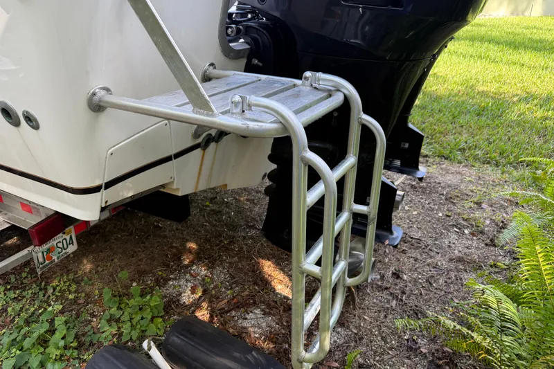 Slide: The Image of 2002 SeaCraft SC32 Master Angler boat ladder and motor detail. - 5