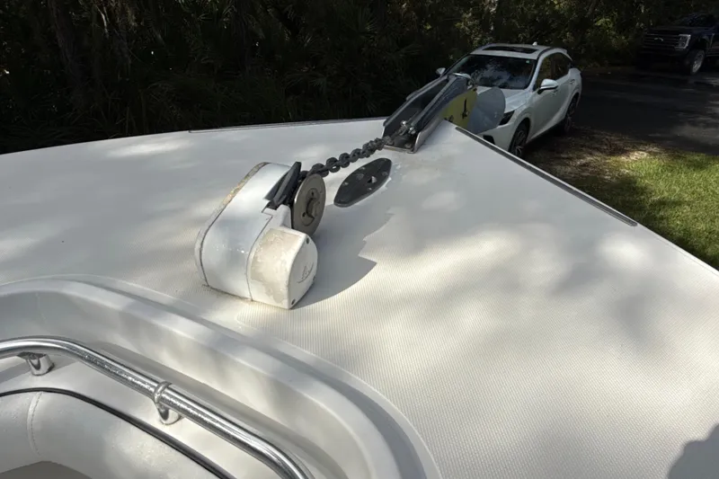 Slide: The Image of 2002 SeaCraft SC32 Master Angler boat deck with anchor chain mechanism. - 55