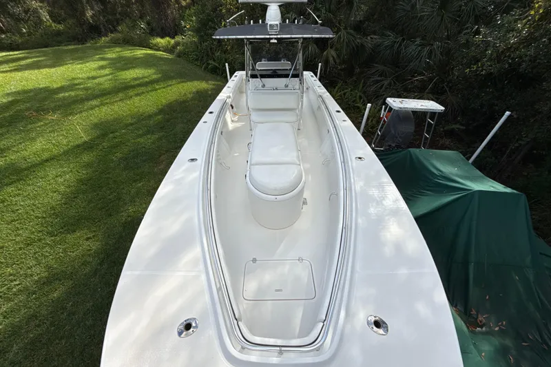 Slide: The Image of 2002 SeaCraft SC32 Master Angler boat on grass, top view, surrounded by trees. - 56