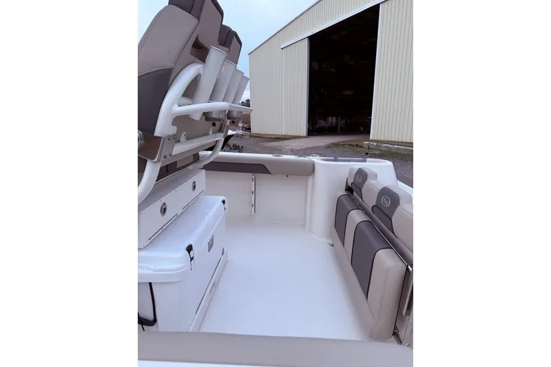 Slide: The Image of 2026 Key West 244 Center Console boat hull on display outdoors. - 2