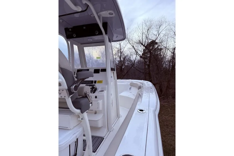 Slide: The Image of 2026 Key West 244 Center Console boat with dual outboard motors, rear view. - 6
