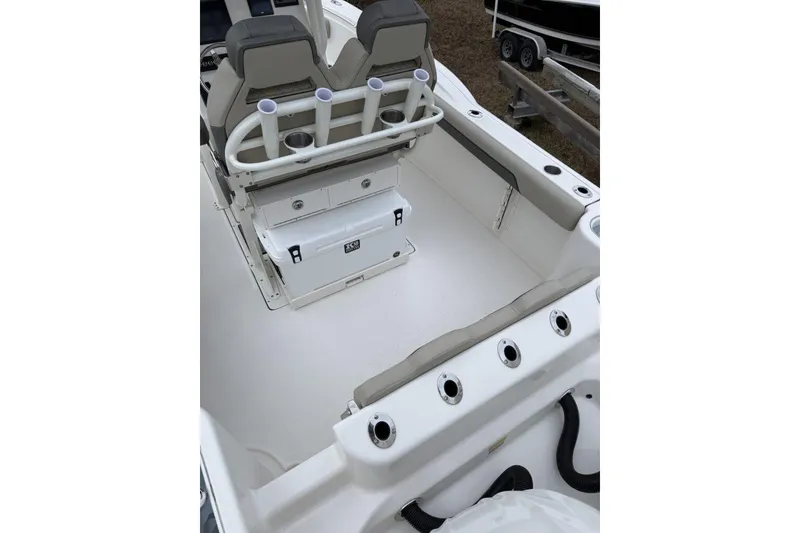 Slide: The Image of 2026 Key West 244 Center Console boat, sleek design, white interior, outdoor setting. - 7