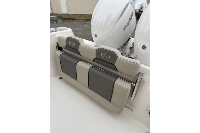 Slide: The Image of 2026 Key West 244 Center Console boat interior with seating and rod holders. - 8