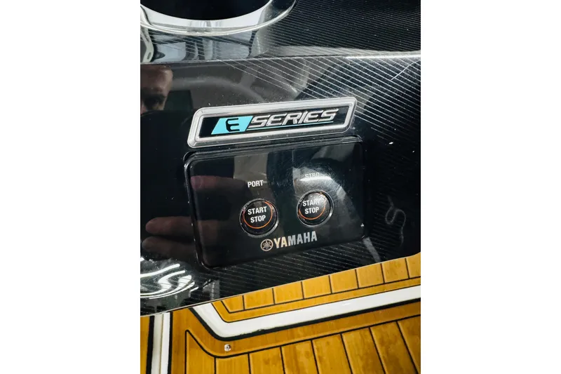 Slide: The Image of 2024 Yamaha Boats 275SD E-Series dashboard with start/stop buttons. - 10
