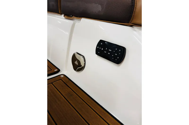 Slide: The Image of 2024 Yamaha Boats 275SD interior detail with control panel and teak flooring. - 12