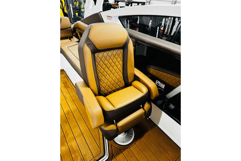 Slide: The Image of Luxurious seating on 2024 Yamaha Boats 275SD, featuring diamond-stitched upholstery and elegant design. - 16