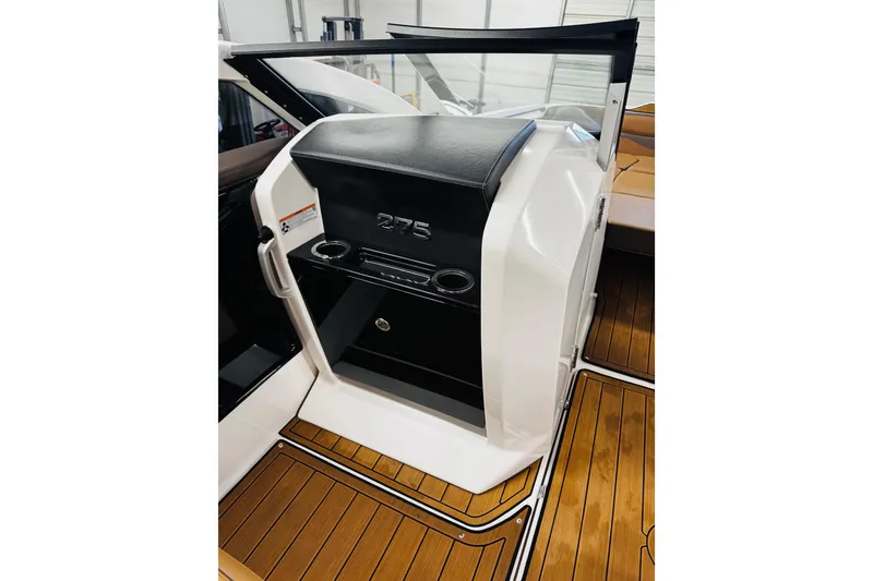 Slide: The Image of 2024 Yamaha Boats 275SD interior with sleek design and wood flooring. - 20