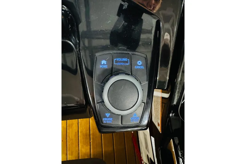 Slide: The Image of Control panel of 2024 Yamaha Boats 275SD with navigation and volume buttons. - 9