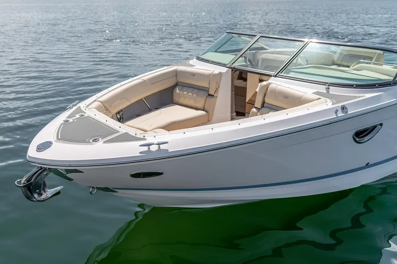 Slide: The Image of Manufacturer Provided Image: 2026 Regal LS6 boat on calm water, featuring sleek design and spacious seating. - 2