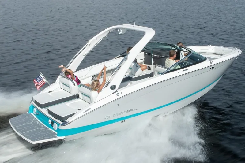 Slide: The Image of Manufacturer Provided Image: 2026 Regal LS6 boat cruising on water with passengers enjoying the ride. - 4
