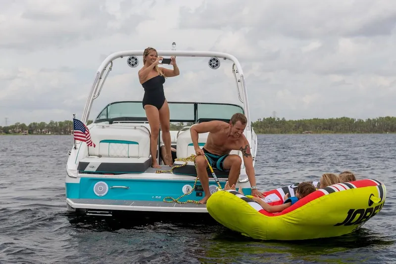 Slide: The Image of Manufacturer Provided Image: Family enjoying water activities on a 2026 Regal LS6 boat. - 5