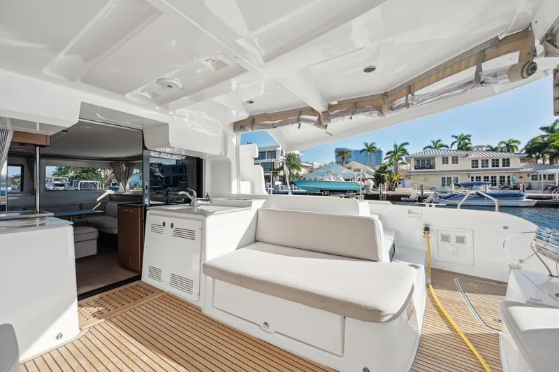 Slide: The Image of 2022 Lagoon 46 yacht interior with spacious seating and modern design. - 20
