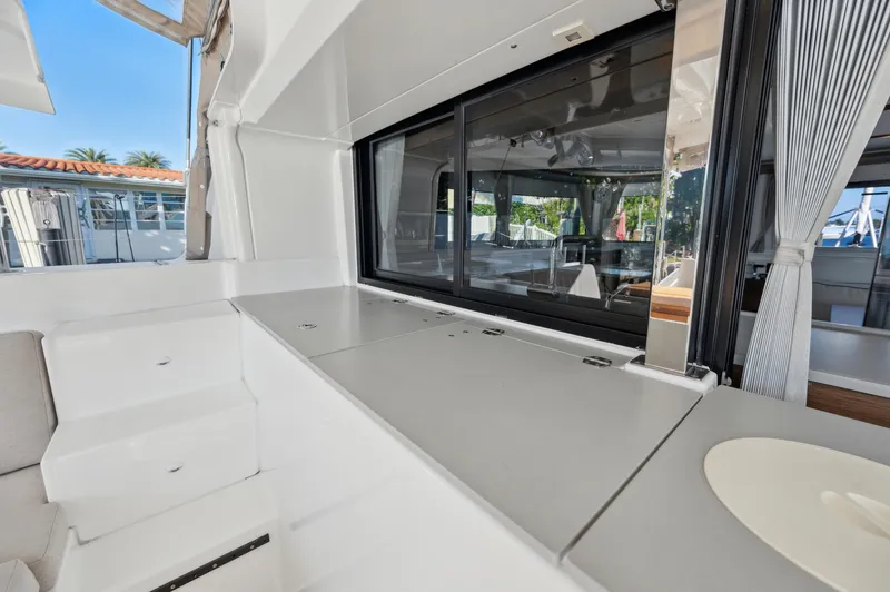 Slide: The Image of 2022 Lagoon 46 yacht interior with sleek countertops and modern design. - 22