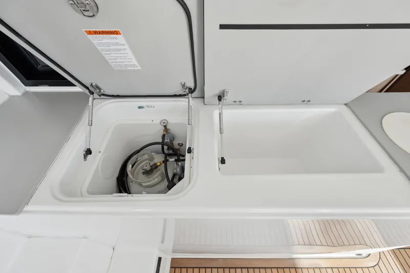 Slide: The Image of Lagoon 46 yacht 2022 model with open storage compartment and equipment. - 23