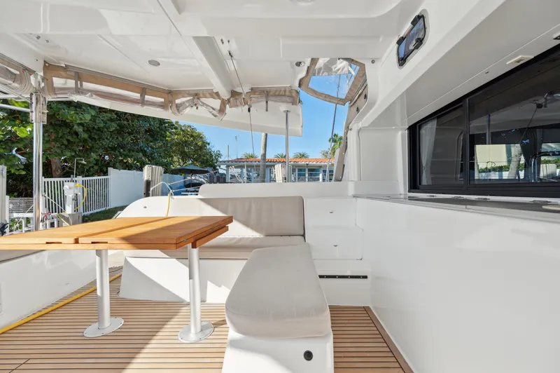 Slide: The Image of 2022 Lagoon 46 yacht interior with seating and wooden table. - 25