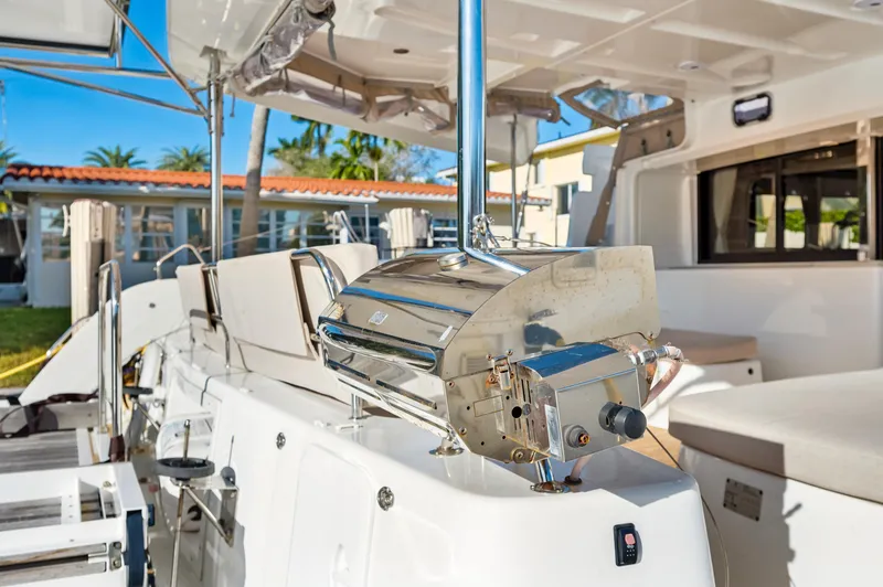 Slide: The Image of 2022 Lagoon 46 yacht deck with stainless steel grill and seating area. - 28