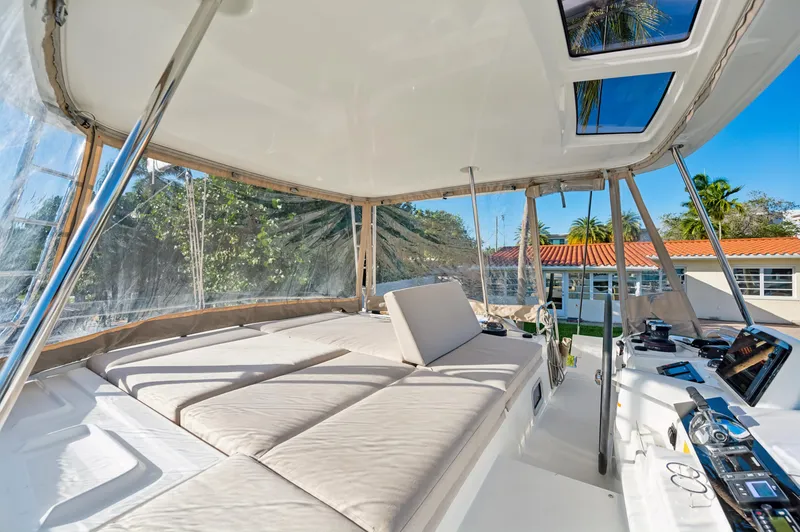 Slide: The Image of Luxurious 2022 Lagoon 46 yacht interior with spacious seating and modern controls. - 32