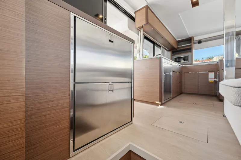 Slide: The Image of Modern kitchen interior of 2022 Lagoon 46 yacht with sleek wood and stainless steel finishes. - 45