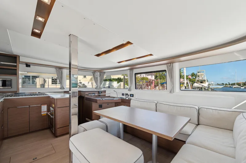 Slide: The Image of Luxurious interior of 2022 Lagoon 46 catamaran with spacious seating and modern design. - 47