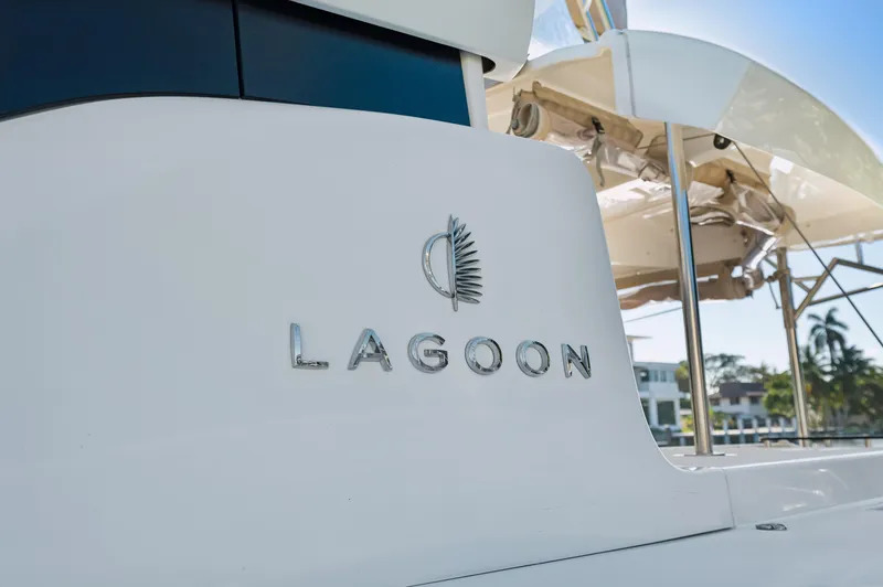 Slide: The Image of 2022 Lagoon 46 yacht, close-up of logo and sleek design. - 8