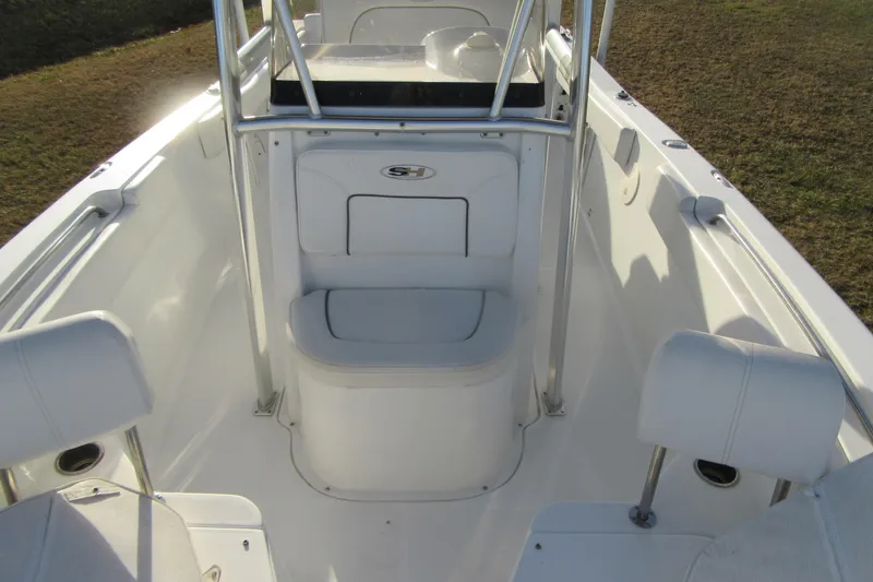 Slide: The Image of 2014 Sea Hunt Ultra 234 boat interior with seating and console. - 11