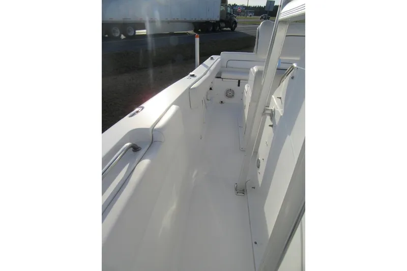 Slide: The Image of 2014 Sea Hunt Ultra 234 boat interior, showcasing seating and deck layout. - 15