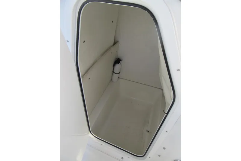 Slide: The Image of Interior storage compartment of 2014 Sea Hunt Ultra 234 boat. - 16