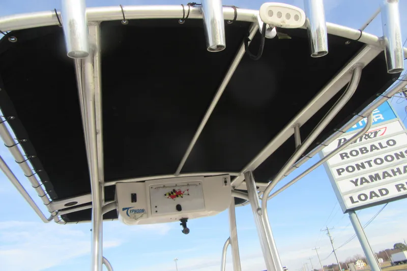 Slide: The Image of 2014 Sea Hunt Ultra 234 T-top with rod holders and electronics box. - 17