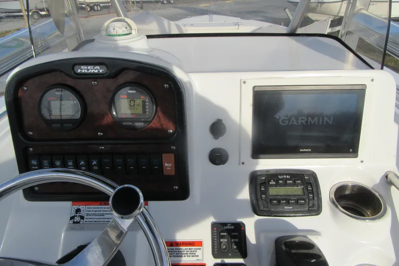 Slide: The Image of 2014 Sea Hunt Ultra 234 dashboard with Garmin display and Yamaha gauges. - 20