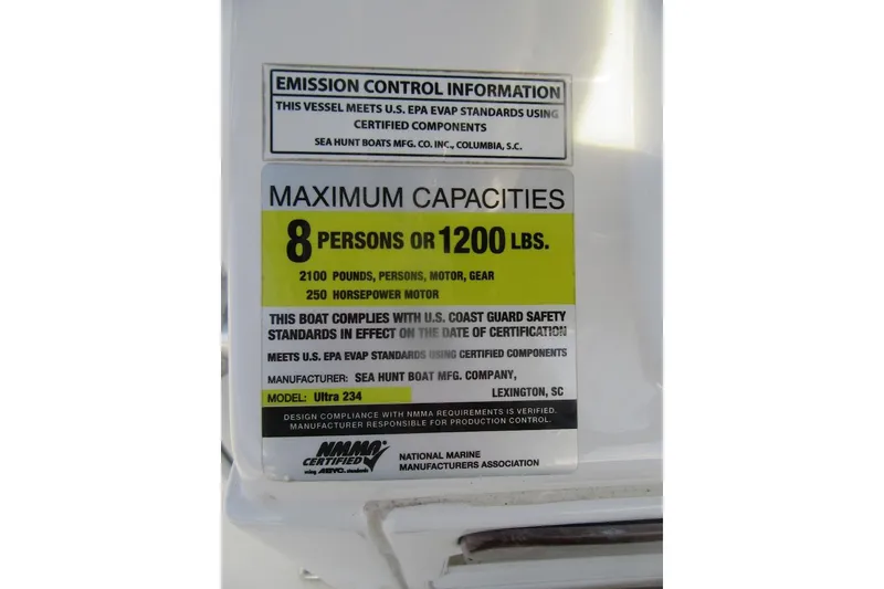 Slide: The Image of 2014 Sea Hunt Ultra 234 capacity label, 8 persons or 1200 lbs, 250 horsepower motor. - 23