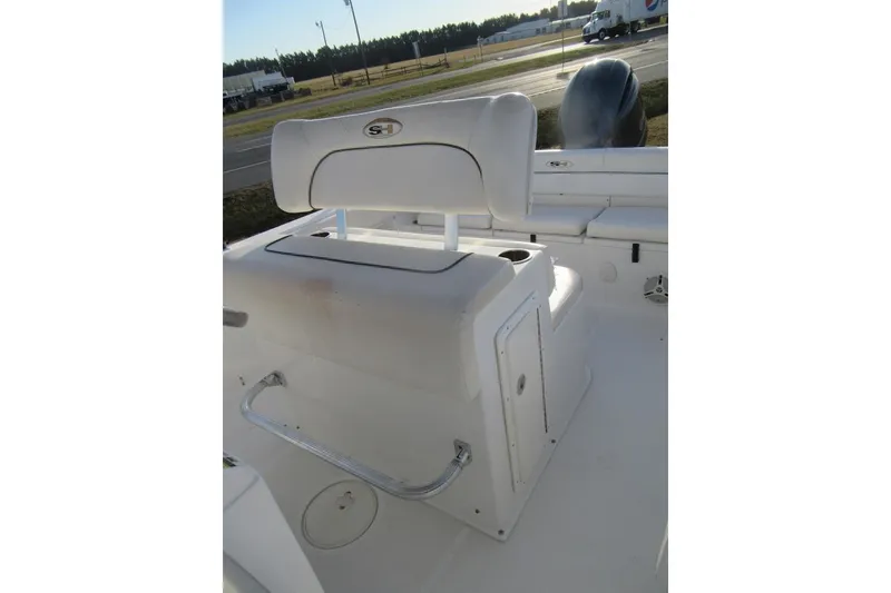 Slide: The Image of 2014 Sea Hunt Ultra 234 boat interior with seating and storage compartments. - 25