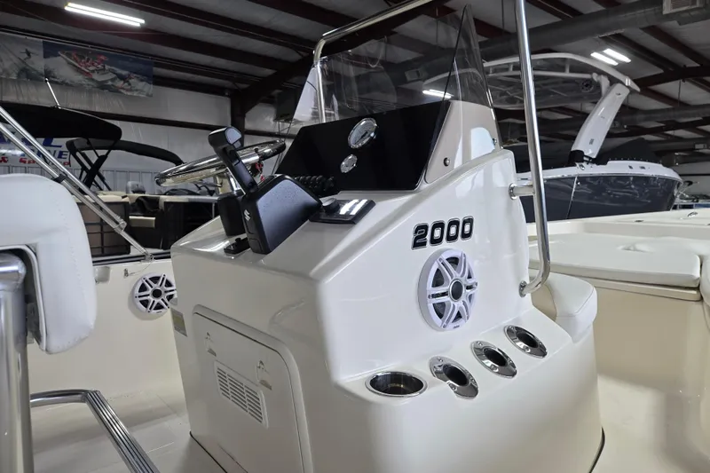 Slide: The Image of 2026 Bulls Bay 2000 boat console with steering wheel and controls in showroom. - 12