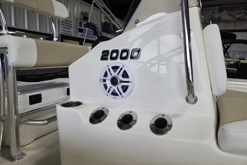 Slide: The Image of Bulls Bay 2000 boat interior, featuring speaker and cup holders, 2026 model. - 15