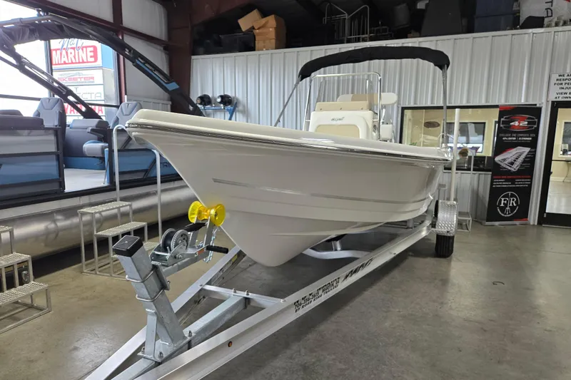 Slide: The Image of 2026 Bulls Bay 2000 boat on trailer in showroom, featuring sleek design and modern build. - 3