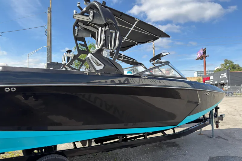Slide: The Image of 2018 Nautique Super Air Nautique G25 Coastal Edition boat in a parking lot. - 4