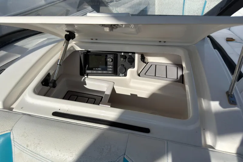Slide: The Image of 2018 Nautique Super Air Nautique G25 Coastal Edition dashboard with JL Audio system. - 9