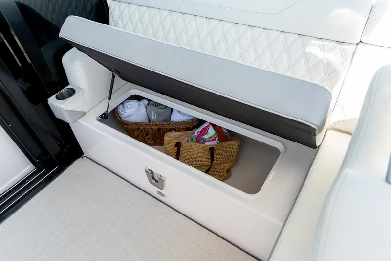 Slide: The Image of Manufacturer Provided Image: Storage compartment in 2026 Regal 36 Grande Coupe, featuring elegant seating and practical storage. - 18
