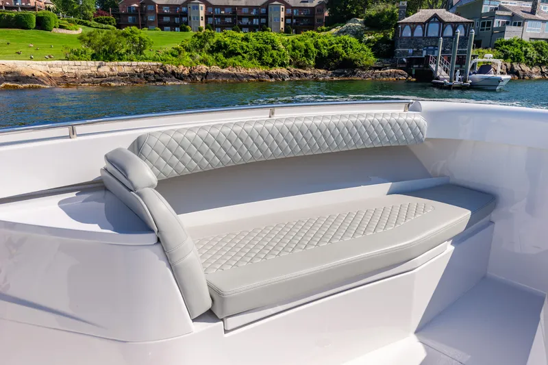 Slide: The Image of Luxurious seating on the 2024 HCB 39 Speciale boat with waterfront view. - 19