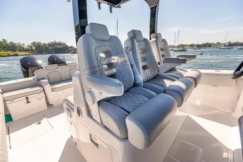 Slide: The Image of 2024 HCB 39 Speciale luxury boat interior with plush seating and scenic water view. - 27