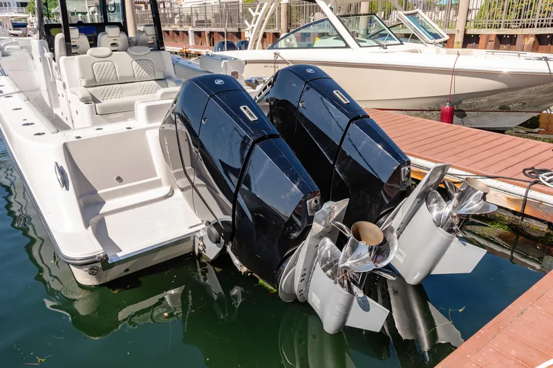 Slide: The Image of 2024 HCB 39 Speciale boat with dual outboard engines docked. - 36