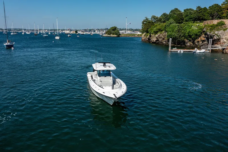 Slide: The Image of 2024 HCB 39 Speciale boat cruising in a scenic harbor. - 6