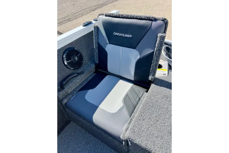 Slide: The Image of 2024 Crestliner 1650 Fish Hawk SC boat seat with speaker, gray and black design. - 14