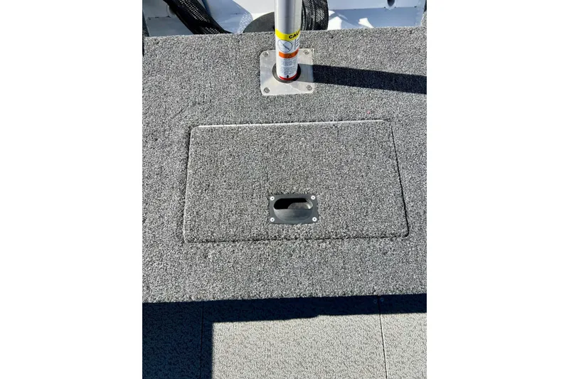 Slide: The Image of 2024 Crestliner 1650 Fish Hawk SC boat deck with storage compartment. - 20