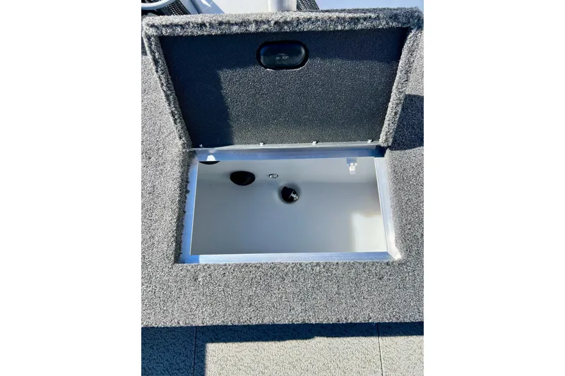Slide: The Image of Open storage compartment in 2024 Crestliner 1650 Fish Hawk SC boat. - 21