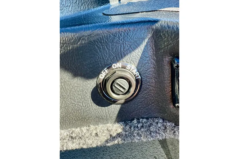 Slide: The Image of 2024 Crestliner 1650 Fish Hawk SC ignition switch with off, on, start positions. - 36