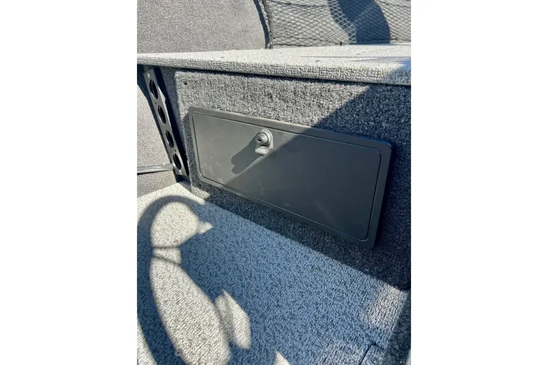 Slide: The Image of 2024 Crestliner 1650 Fish Hawk SC interior storage compartment detail. - 39