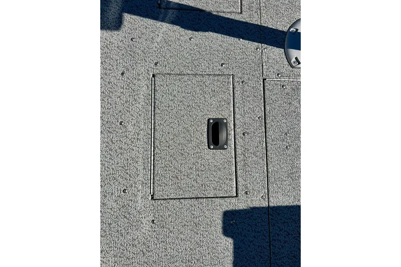 Slide: The Image of 2024 Crestliner 1650 Fish Hawk SC boat deck with storage compartment. - 41