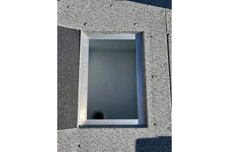 Slide: The Image of 2024 Crestliner 1650 Fish Hawk SC boat storage compartment with textured surface. - 42