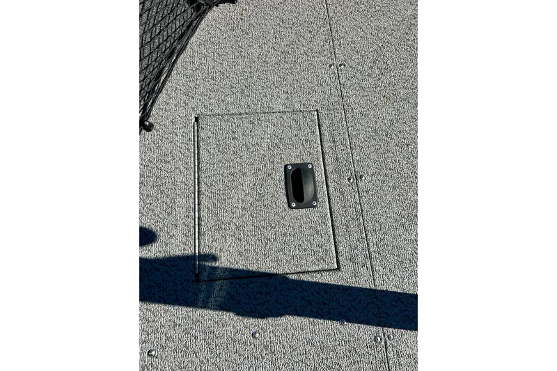 Slide: The Image of 2024 Crestliner 1650 Fish Hawk SC boat deck with storage compartment. - 43