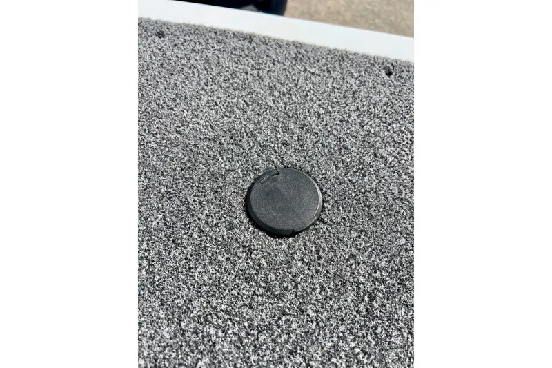 Slide: The Image of 2024 Crestliner 1650 Fish Hawk SC boat deck with textured surface and circular hatch. - 47